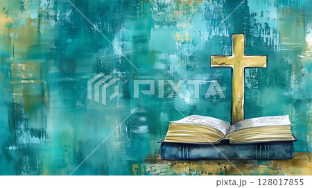 A wooden background featuring a cross on an open book with a textured blue backdrop 128017855