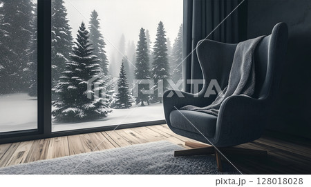Cozy winter interior with a comfy chair and snowy outdoor landscape decorated for Christmas 128018028