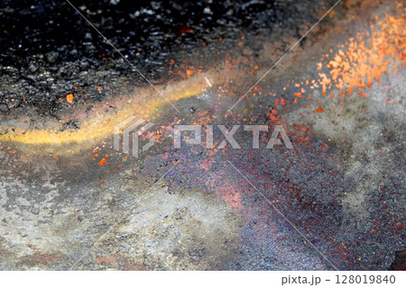 Close up of heavy black rust on a brass base of a kitchen sauce pan abstract background 128019840