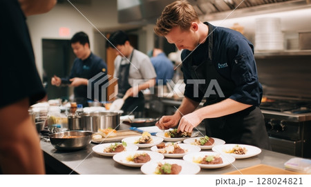 Chefs Plating Gourmet Dishes in Professional Kitchen Chefs Plating Gourmet Dishes in Professional Kitchen 128024821