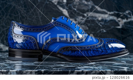 A sophisticated laceup brogue shoe handcrafted from genuine exotic leather dyed a striking cobalt blue with handpainted detailing 128026616