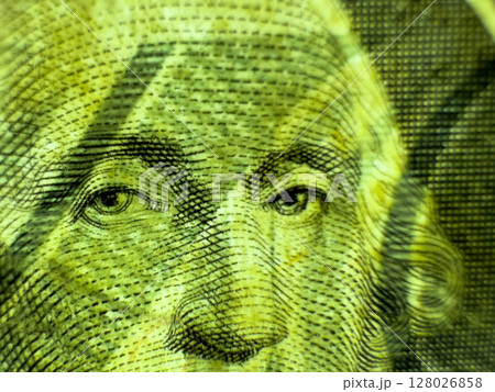 Green face of George Washington on a crumpled dollar bill in close up macro in grayscale Green face of George Washington on a crumpled dollar bill in close up macro in grayscale 128026858