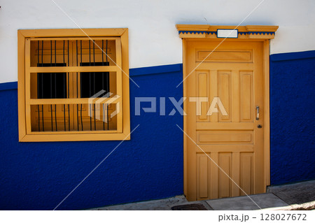 Beautiful facades of the colonial houses at the streets of the Heritage Town of Jerico located in the Department of Antioquia in Colombia. 128027672
