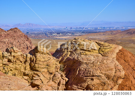 Red Rock Canyon and Las Vegas Skyline Contrast from Eye-Level Perspective 128030863