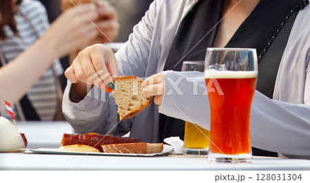 Casual Dining with Beverages and Bread on an Outdoor Table Casual Dining with Beverages and Bread on an Outdoor Table 128031304
