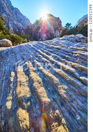 Sunburst Over Striated Rocks in Ice Box Canyon Low Angle Perspective 128031349