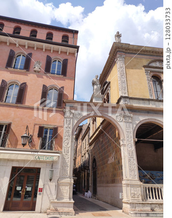 Verona, Italy - May 12, 2025: Street view of Piazza Dei Signori Verona city Italy in front of historical building Palace of the Podesta 128033733