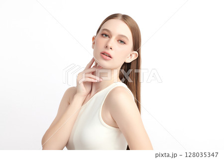 A beautiful young woman with clean, fresh skin against a white background. Skincare, facial treatment, cosmetology, beauty, and spa. An elegant portrait of an woman. A beautiful young woman with clean, fresh skin against a white background. Skincare, facial treatment, cosmetology, beauty, and spa. An elegant portrait of an woman. 128035347