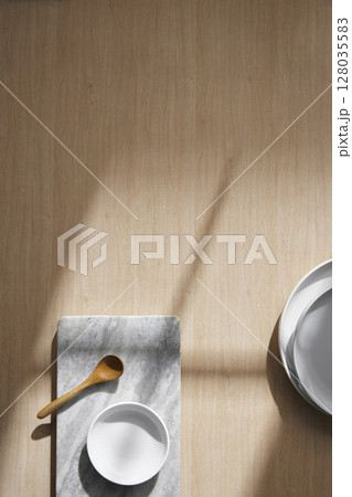 Light and Shadow on Wooden Texture with Modern Objects. Minimal Home Decor Scene with Ceramic Trays. Light and Shadow on Wooden Texture with Modern Objects. Minimal Home Decor Scene with Ceramic Trays. 128035583