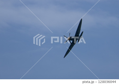 Spitfire plane in flight on sunny day. High quality photo Spitfire plane in flight on sunny day. High quality photo 128036044