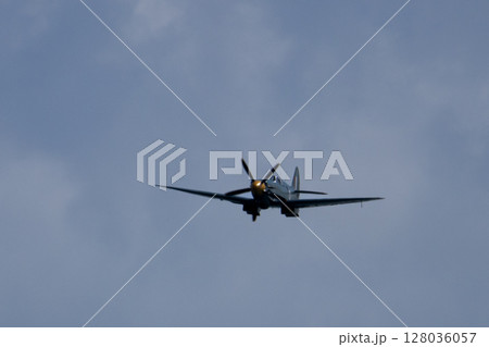 Spitfire plane in flight on sunny day. High quality photo 128036057