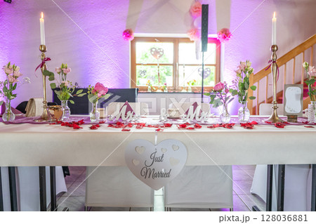 Wedding decor. Close up of a wedding table decoration with white and pink flowers and candles Wedding floristic concept 128036881