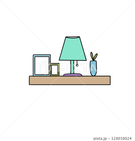 A shelf with a lamp, vase, and picture frames 128038024
