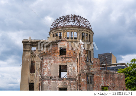Genbaku Dome ruins at Hiroshima Peace Memorial under a cloudy sky, Japan 128038171