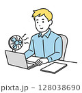 デスクで扇風機を使いながら仕事をする男性（夏のオフィス） 128038690