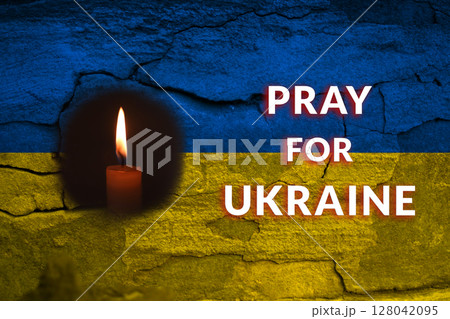 A solemn act of prayer for Ukraine, amidst the ruined landscapes of war and shelling. The scene reflects the somber reality for victims in cities like Kyiv, Dnipro, Odesa, and Kharkiv 128042095