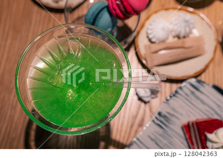 Green cocktail on a wooden table 128042363
