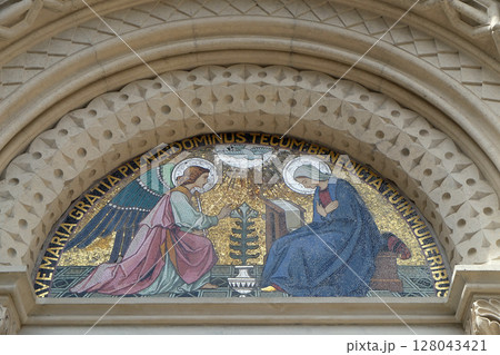 Annunciation, lunette above the entrance to the Franciscan Church of St. Mary Mother of Mercy in Maribor, Slovenia Annunciation, lunette above the entrance to the Franciscan Church of St. Mary Mother of Mercy in Maribor, Slovenia 128043421