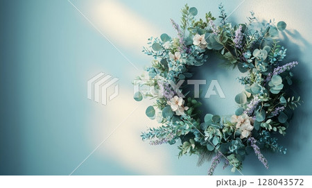 Delicate Pastel Floral Wreath with Eucalyptus on Soft Blue Background 128043572