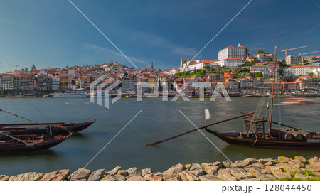Porto, Portugal old town skyline on the Douro River with rabelo boats timelapse hyperlapse. 128044450