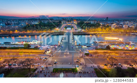 Aerial view of river Seine, Trocadero and La Defense from the Eiffel tower. Day to night timelapse. Paris, France, Europe. 128044583
