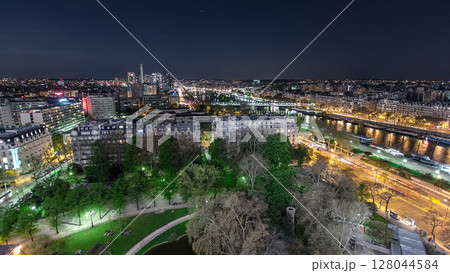 Aerial view of river Seine from the Eiffel tower night timelapse. Paris, France, Europe. 128044584