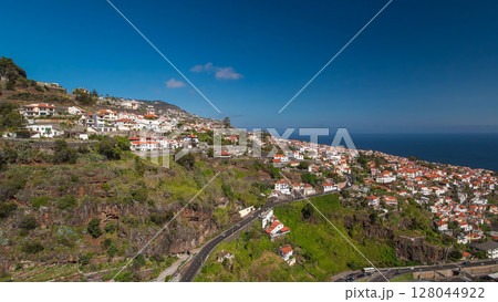 Aerial view from the mountain over the rooftops from cable car on Madeira timelapse hyperlapse. Aerial view from the mountain over the rooftops from cable car on Madeira timelapse hyperlapse. 128044922