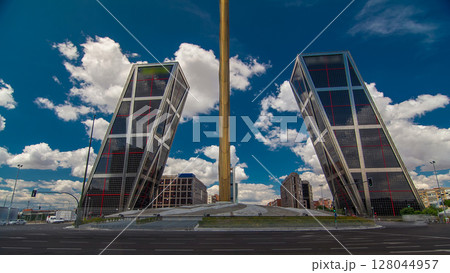 KIO towers or Gateway of Europe timelapse hyperlapse from Plaza de Castilla in Madrid, Spain. 128044957