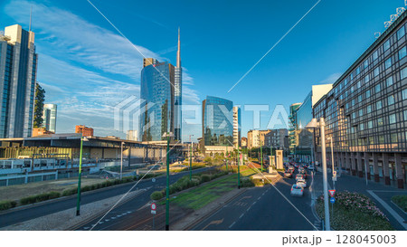 Milan skyline with modern skyscrapers in Porta Nuova business district timelapse hyperlapse in Milan, Italy, at sunset. 128045003