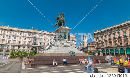 Vittorio Emanuele II statue at Piazza del Duomo timelapse hyperlapse. Milan in Lombardy, Italy. 128045016