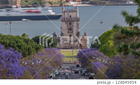 View of Avenida Torre de Belem timelapse, with cars and the Belem Tower in the background. Lisbon, Portugal 128045054