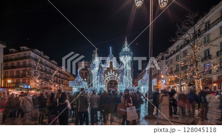 Night timelapse hyperlapse of Christmas decorations with illuminated castle on Luis de Camoes square in Lisbon, Portugal. Night timelapse hyperlapse of Christmas decorations with illuminated castle on Luis de Camoes square in Lisbon, Portugal. 128045118