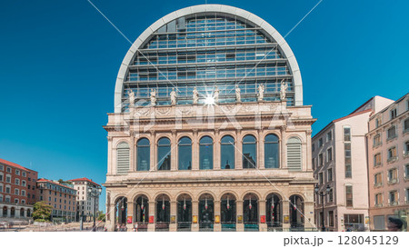 Hyperlapse of Lyon's opera house featuring neoclassical architecture combined with a modern glass dome roof. France Hyperlapse of Lyon's opera house featuring neoclassical architecture combined with a modern glass dome roof. France 128045129