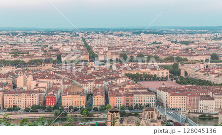 Timelapse panoramic aerial view of Lyon during sunset from Fourviere Hill. France 128045136
