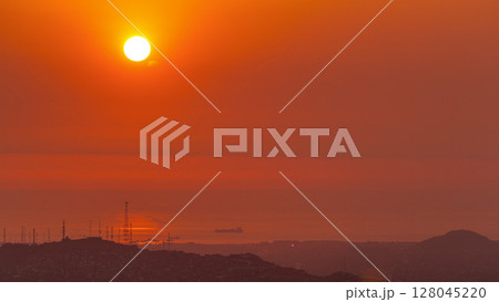 Aerial view of the Pacific ocean during sunset timelapse from Cerro San Cristobal, Lima 128045220