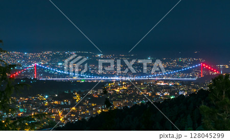 Fatih Sultan Mehmet Bridge view, connects Asia and Europe night timelapse from top of Camlyca hill. Istanbul, Turkey Fatih Sultan Mehmet Bridge view, connects Asia and Europe night timelapse from top of Camlyca hill. Istanbul, Turkey 128045299