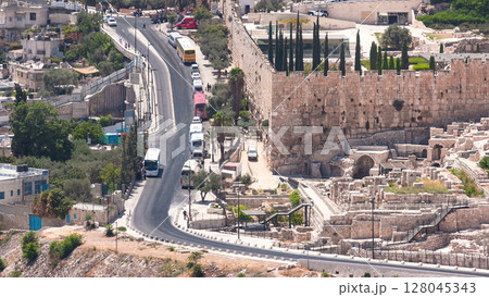 Close up view to Jerusalem timelapse with traffic on the road from the Mount of Olives. Close up view to Jerusalem timelapse with traffic on the road from the Mount of Olives. 128045343