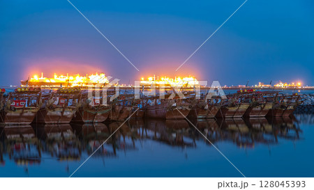 Fishing boat parked near the fish market next to Kuwait City Area day to night timelapse Fishing boat parked near the fish market next to Kuwait City Area day to night timelapse 128045393