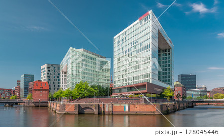Timelapse of Hamburg HafenCity skyline at Ericusgraben with a view of modern Spiegel office buildings Timelapse of Hamburg HafenCity skyline at Ericusgraben with a view of modern Spiegel office buildings 128045446