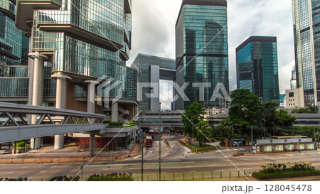 Hong Kong overpass in Central timelapse hyperlapse. Locals and tourists use overpasses to cross downtown streets. 128045478