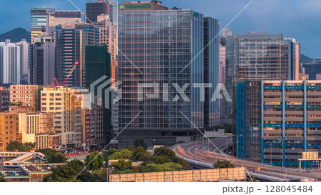 Top aerial view of busy traffic day in finance urban timelapse, hong kong city Top aerial view of busy traffic day in finance urban timelapse, hong kong city 128045484