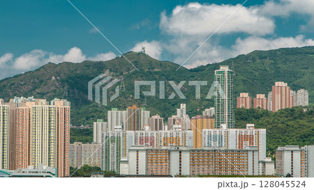 Top view of buildings at day in finance urban timelapse, hong kong city Top view of buildings at day in finance urban timelapse, hong kong city 128045524