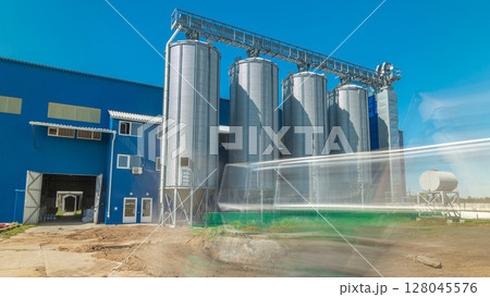 Modern large granary timelapse hyperlapse. Large metal silos. Modern large granary timelapse hyperlapse. Large metal silos. 128045576