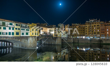 Famous Ponte Vecchio bridge timelapse hyperlapse over the Arno river in Florence, Italy, lit up at night Famous Ponte Vecchio bridge timelapse hyperlapse over the Arno river in Florence, Italy, lit up at night 128045610
