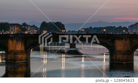 Ponte Santa Trinita Holy Trinity Bridge day to night timelapse over River Arno in Florence Ponte Santa Trinita Holy Trinity Bridge day to night timelapse over River Arno in Florence 128045615