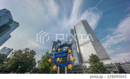 Timelapse hyperlapse of the Euro currency sign in downtown Frankfurt near the former headquarters of the European Central Bank. Germany 128045641