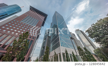 Hyperlapse looking up perspective at glass skyscrapers in Frankfurt's Innenstadt district. Germany Hyperlapse looking up perspective at glass skyscrapers in Frankfurt's Innenstadt district. Germany 128045642