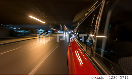 Drivelapse from side of car moving on a night avenue in city timelapse hyperlapse 128045711