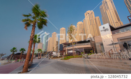 People on the Jumeirah Beach in Dubai, UAE. Timelapse People on the Jumeirah Beach in Dubai, UAE. Timelapse 128045732