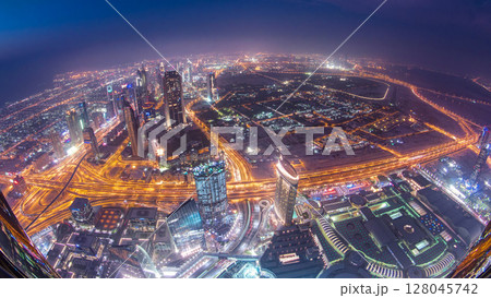Dubai downtown day to night transition with city lights from above timelapse 128045742